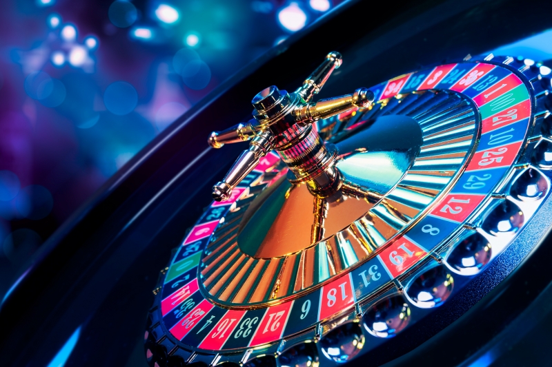 12823575-roulette-wheel-with-a-bright-and-colorful-background